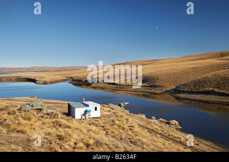 Hütte Logan Burn Reservoir und Lammermoor Bereich alte Dunstan Trail Central Otago Südinsel Neuseeland Stockfoto