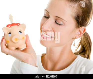 Sparschwein Piggy Bank sparen, sparen junge attraktive schöne Frau economiaing Stockfoto