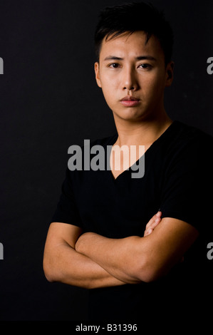 Ein launisch Porträt eines jungen chinesischen männliche Modells Stockfoto