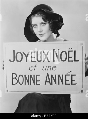 Porträt Frau mit Schild in französischer Sprache Stockfoto