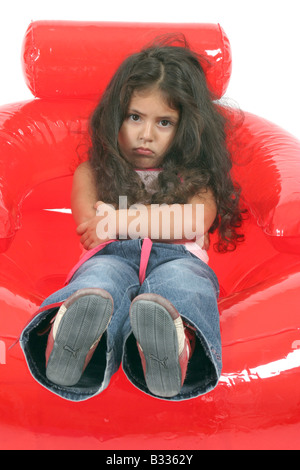 kleines Mädchen im Stuhl Air chair Stockfoto