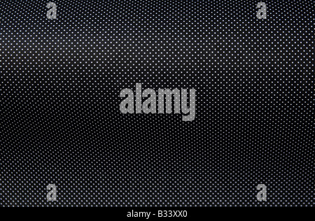 geschwungene weiße Punkte auf schwarzem Hintergrund Stockfoto