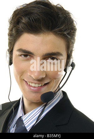 Porträt eines Geschäftsmannes tragen einen Kopfhörer und lächelnd Stockfoto