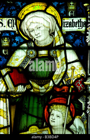 Kostümmalerei und das Kind Jesus Depiced in der Glasmalerei des 13. Jahrhunderts St.George Kirche Woolhope Herefordshire Stockfoto