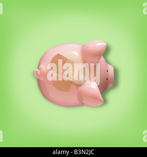 Sparschwein mit Pflaster abdecken der Münzprüfer Stockfoto