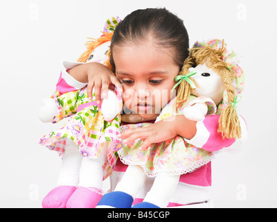 indische Mädchen mit Puppen Stockfoto