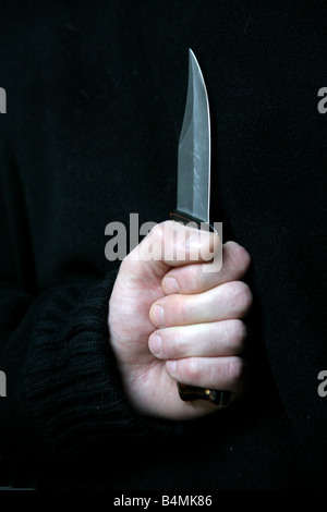 Mann-Betrieb-Messer Stockfoto