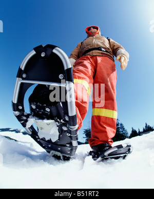 Mann mit Schneeschuhen Stockfoto