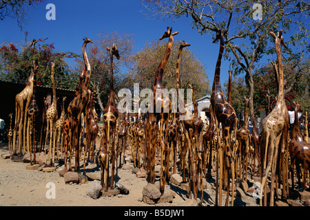 Giraffe Schnitzereien für Verkauf Viktoriafälle Stadt Simbabwe Afrika Stockfoto