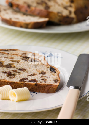 Scheibe der Barm Brack mit Butter Stockfoto