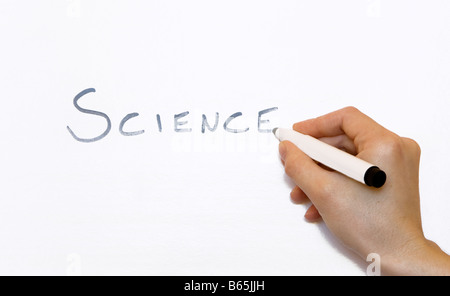 Ein Lehrer schreiben Wissenschaft auf einem whiteboard Stockfoto