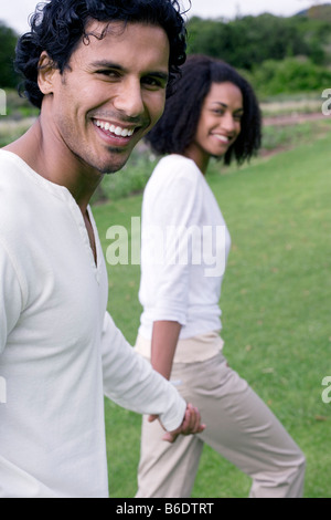 Happy couple holding hands. Stockfoto