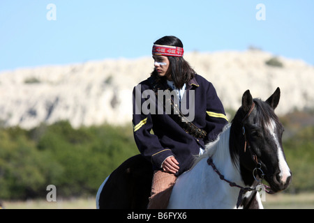 Ein Apache Native American Indian auf ein Farben-Pferd in Texas Stockfoto