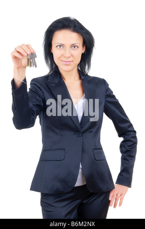 Geschäftsfrau auf einem weißen Hintergrund hielt Hausschlüssel Stockfoto