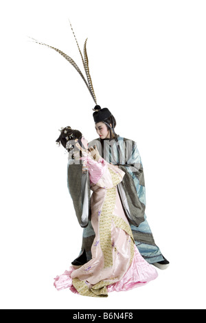 Frau und Mann in traditioneller Kleidung sahen einander Stockfoto