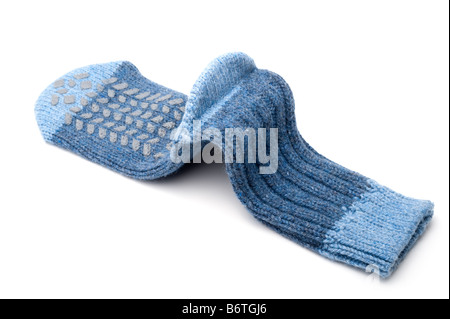 Gestrickte Ferse in ein blauer wollene Pantoffel Socken Stockfoto