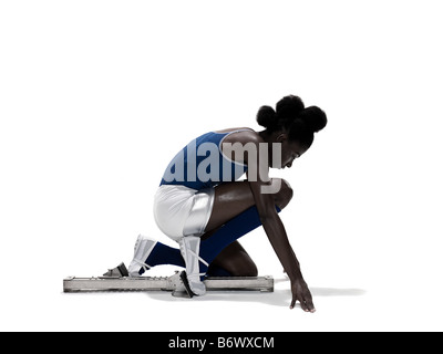 Junge Frau in Startlöchern Stockfoto