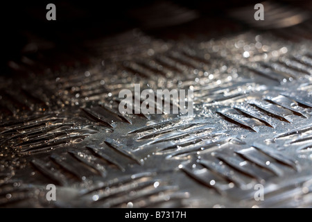 Künstlerische Nahaufnahme eines Stahls tread Platte Stockfoto