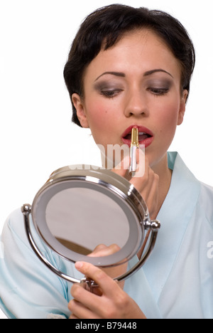 Frau Auftragen von Lippenstift Stockfoto