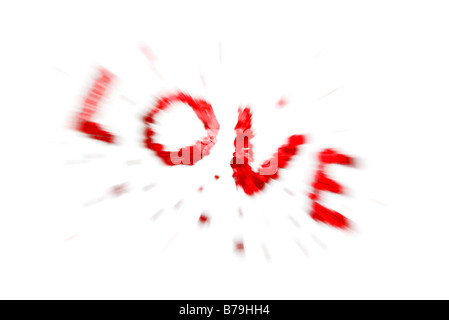 Das Wort Liebe in rotes Herz Konfetti auf weißem Hintergrund mit Zoom burst Stockfoto