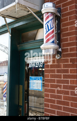 Die Tür von einem Friseur Stockfoto