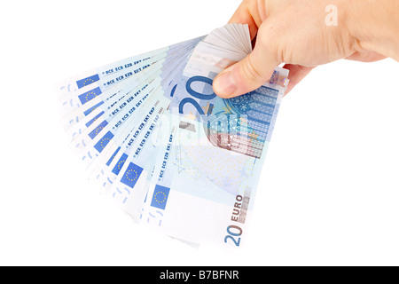 männliche Hand, die 20 Euro-Banknote Stockfoto