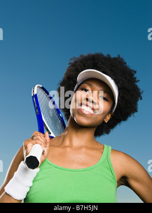 Afrikanische Frau mit Tennisschläger Stockfoto