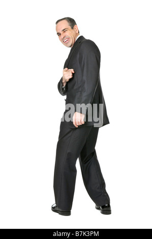 Glücklich Geschäftsmann im Anzug zeigt auf den Betrachter isoliert auf weißem Hintergrund Stockfoto