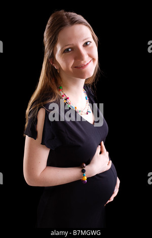 Glückliche Schwangerschaft. 25 Wochen schwanger schöne junge Frau Stockfoto