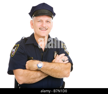 Schöne Reife Polizist lächelnd in seiner einheitlichen Isolated on white Stockfoto