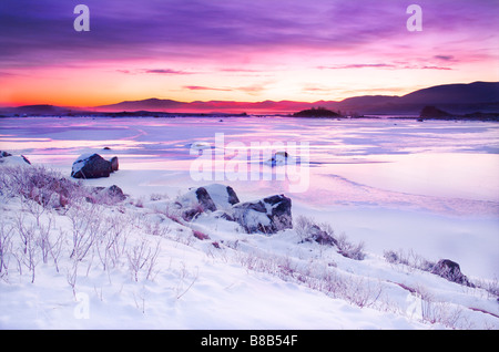 Sonnenaufgang über dem gefrorenen Rannoch Moor-Winter 2009-Schnee-Eis Stockfoto