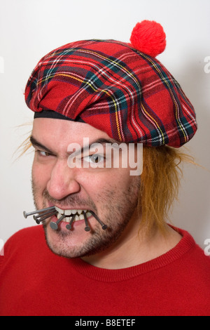 Wütend Scotsman kauen Nägel. Stockfoto