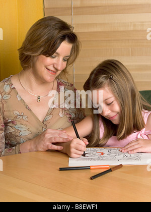 Lehrer und Kind malen ein Bild von Jesus in der Sonntagsschule Stockfoto