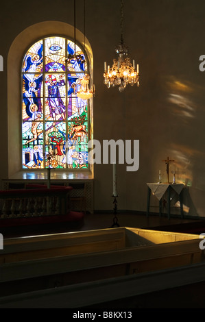 Churchwindow mit Sonne durch Stockfoto