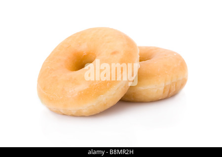 Zwei Donuts oder Krapfen aufgetürmt isoliert auf weiss Stockfoto