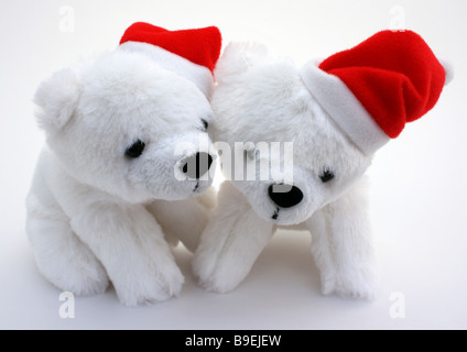 ZWEI PLÜSCHTIER POLAR BÄREN MIT SANTA HÜTE AUF WEIßEM HINTERGRUND HORIZONTALE BDB11138 Stockfoto