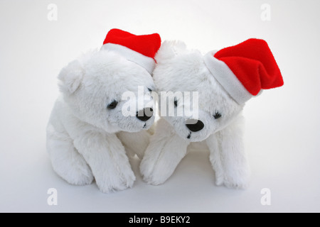 ZWEI PLÜSCHTIER POLAR BÄREN MIT SANTA HÜTE AUF WEIßEM HINTERGRUND HORIZONTALE BDB11134 Stockfoto