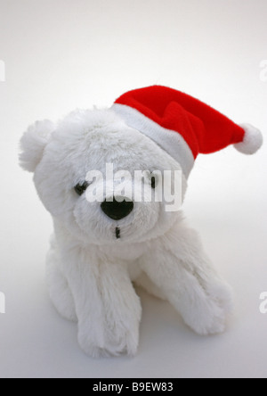 STOFFTIER EISBÄR MIT WEIHNACHTSMÜTZE AUF WEIßEM HINTERGRUND VERTIKALE BDB11133 Stockfoto
