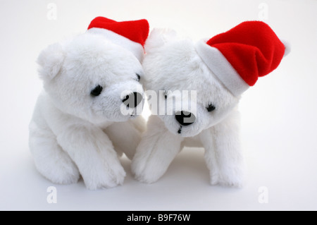 ZWEI PLÜSCHTIER POLAR BÄREN MIT SANTA HÜTE AUF WEIßEM HINTERGRUND HORIZONTALE BDB11137 Stockfoto