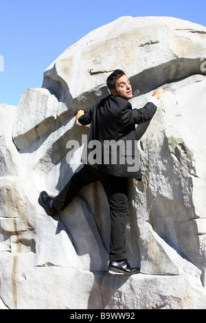 Geschäftsmann Klettern Stockfoto