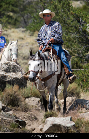 Cowboy-Hut führt Wrangler Cedar Mountain Trail Rides Cody Wyoming USA Stockfoto