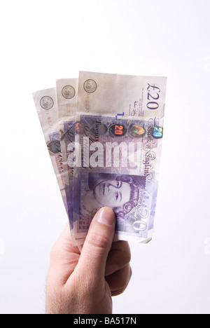 Hand, die britische Geld vor einem weißen Hintergrund Stockfoto