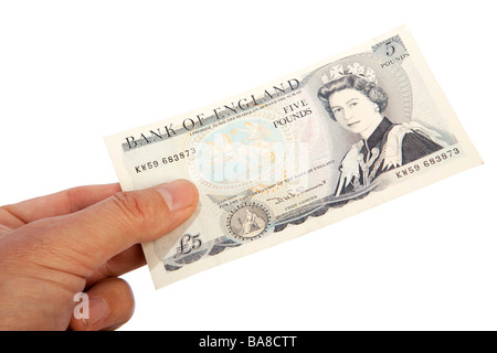 Geld männliche Hand, die alten britischen fünf-Pfund-banknote Stockfoto