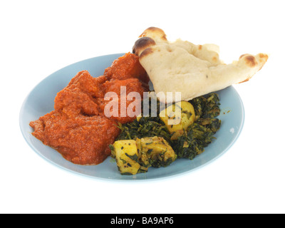 Chicken Tikka Masala mit Sag Aloo Stockfoto