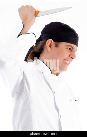 gefährliche männliche Jungkoch mit Messer Stockfoto