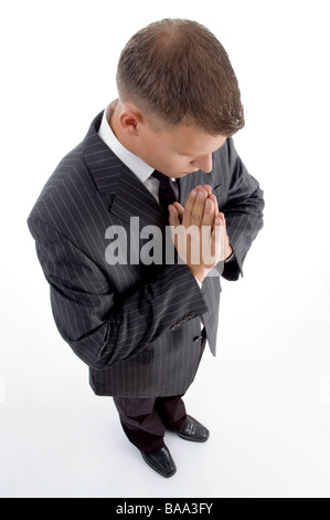 erhöhte Ansicht des betenden Geschäftsmann Stockfoto
