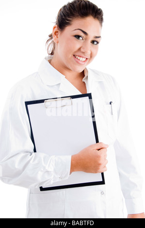 junge Ärztin hält Schreibblock Stockfoto