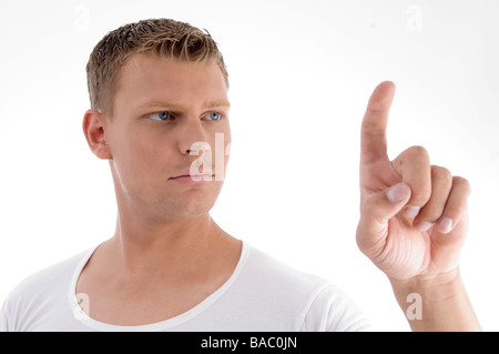 hübscher junger Mann zeigen Stockfoto