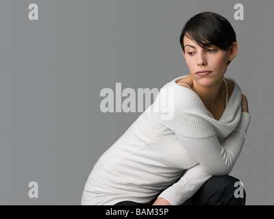 Junge Frau, die traurig Stockfoto