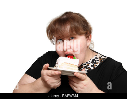 übergewichtige Frau gierig beißende süße Kuchen Stockfoto
